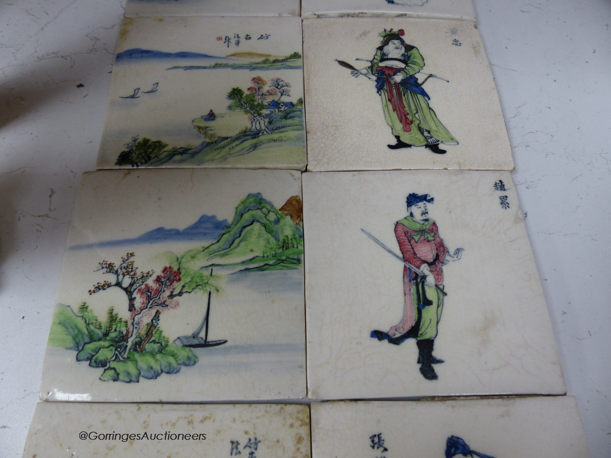 Four Chinese landscape tiles and four Chinese figurative tiles, 13cm square